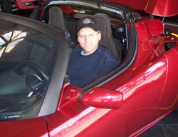 Mike Gray Sitting in a Tesla Roadster at Menlo Park, California